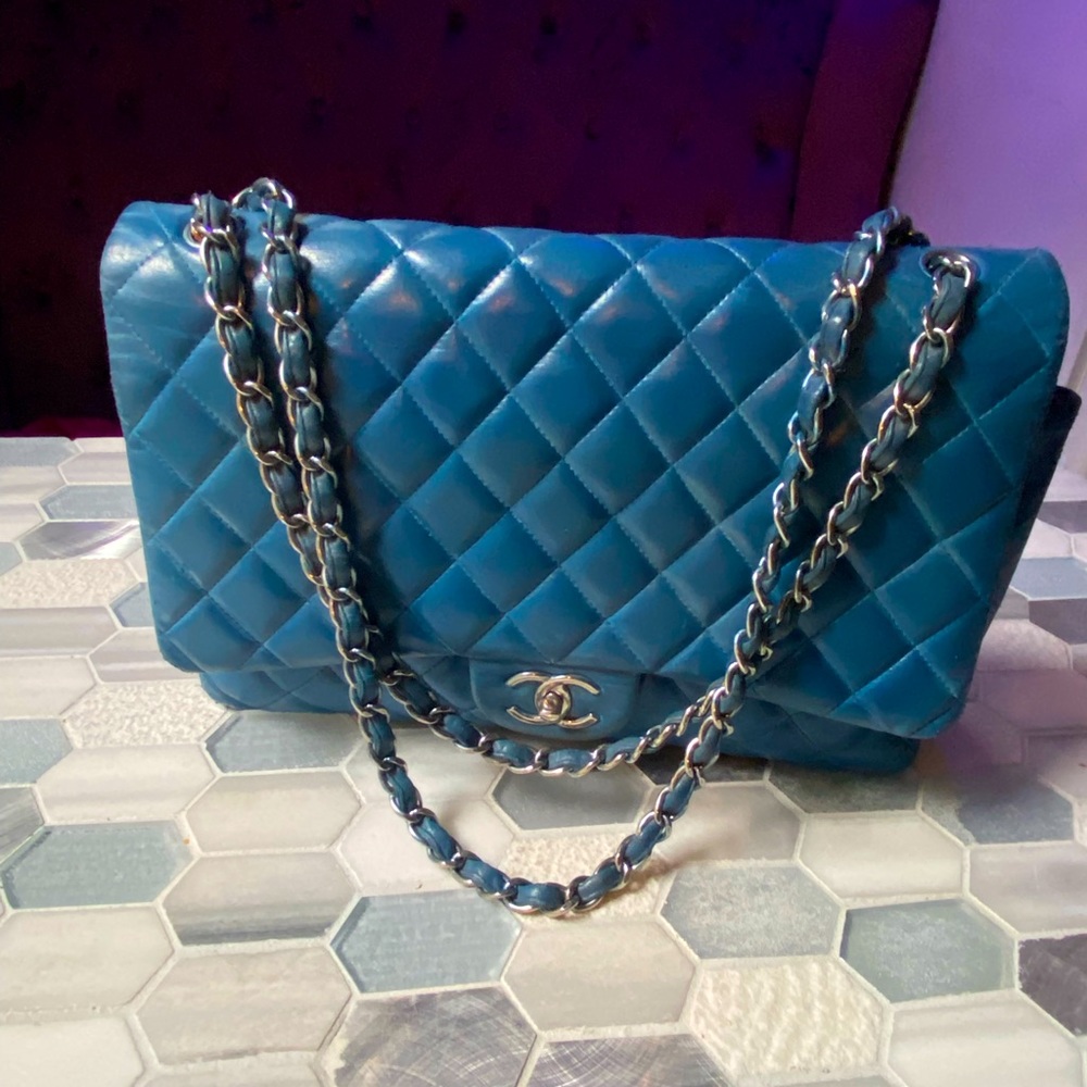 Chanel classic  Maxi Double flap silver hardware blue leather. new condition.